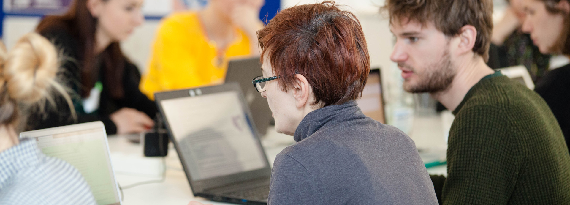 Picture of people working at their computers 