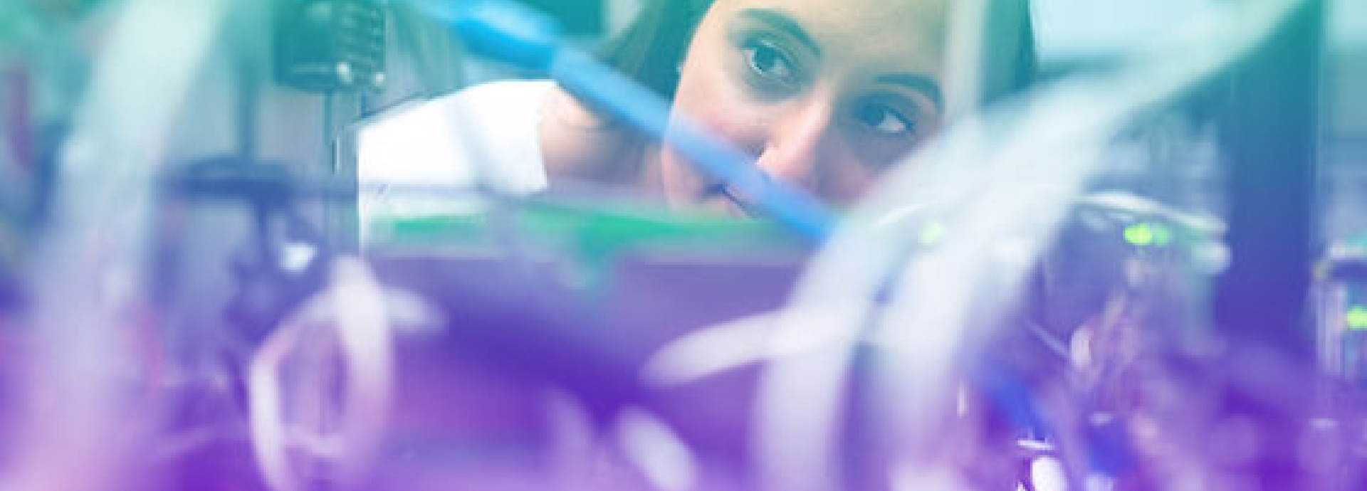 A woman looking at a circuit