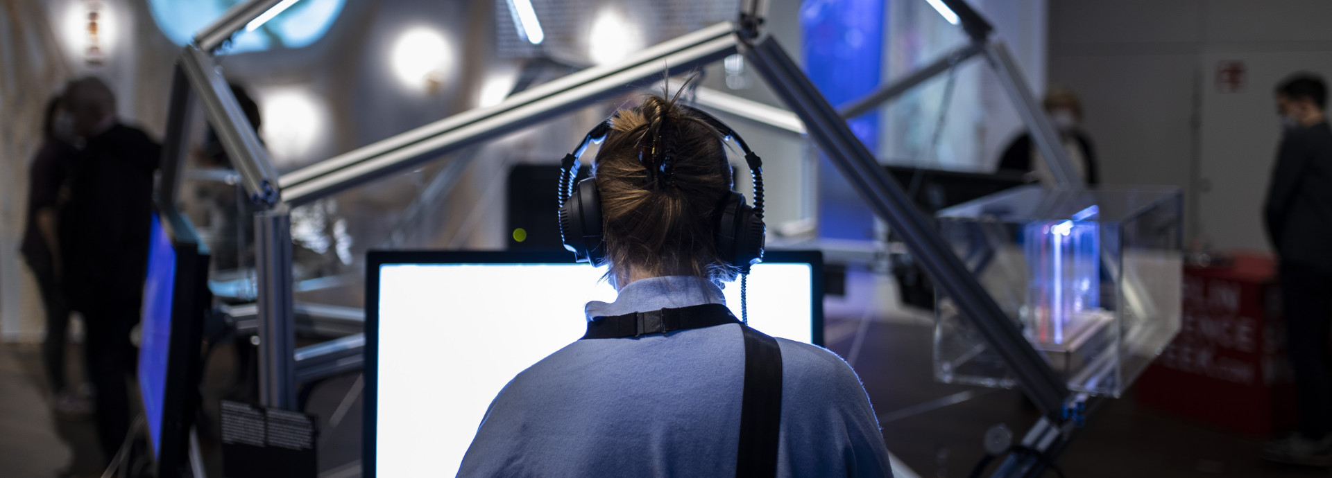 Woman looking at a screen at an exhibition