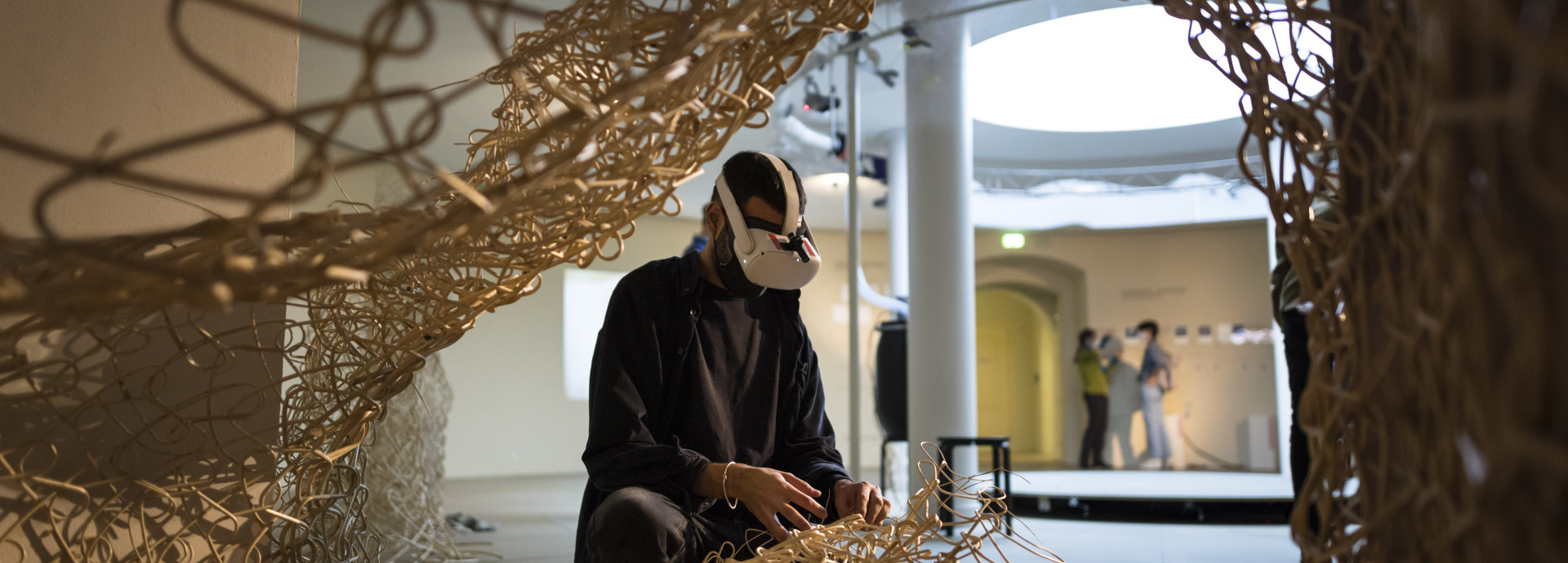 Person using VR in installation