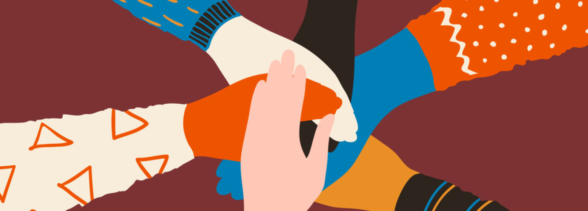 Diverse hands united together.