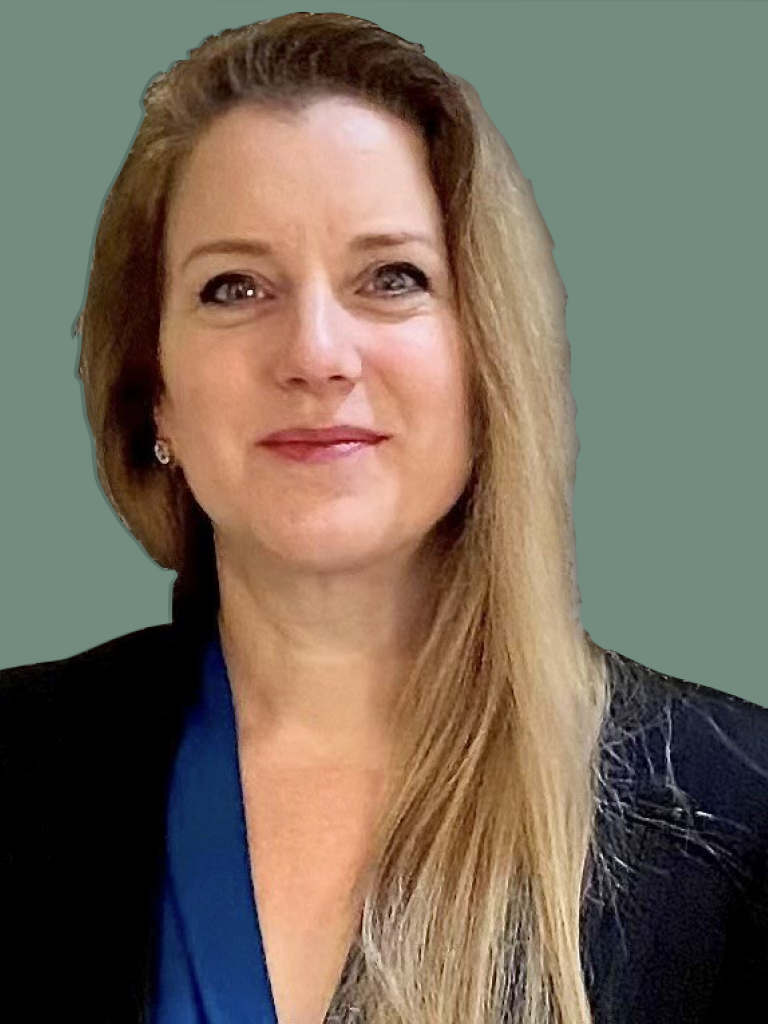 White woman  smiling with dark bond hair falling on her left shoulder