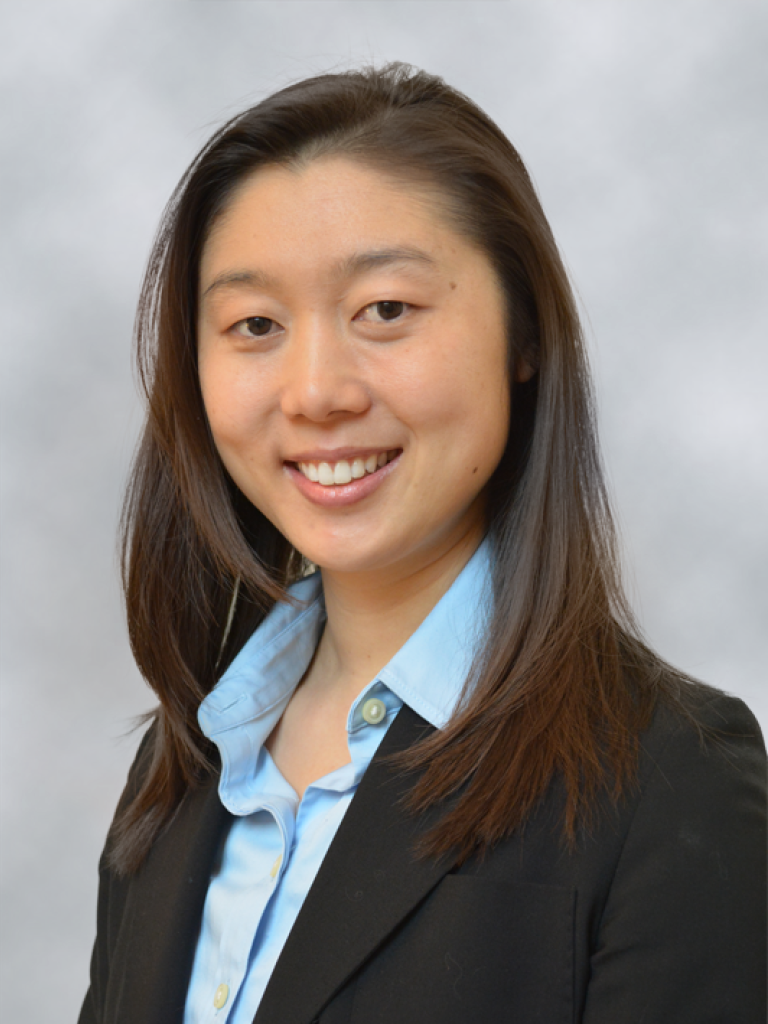 Asian appearing woman with shoulder length black hair. smiling