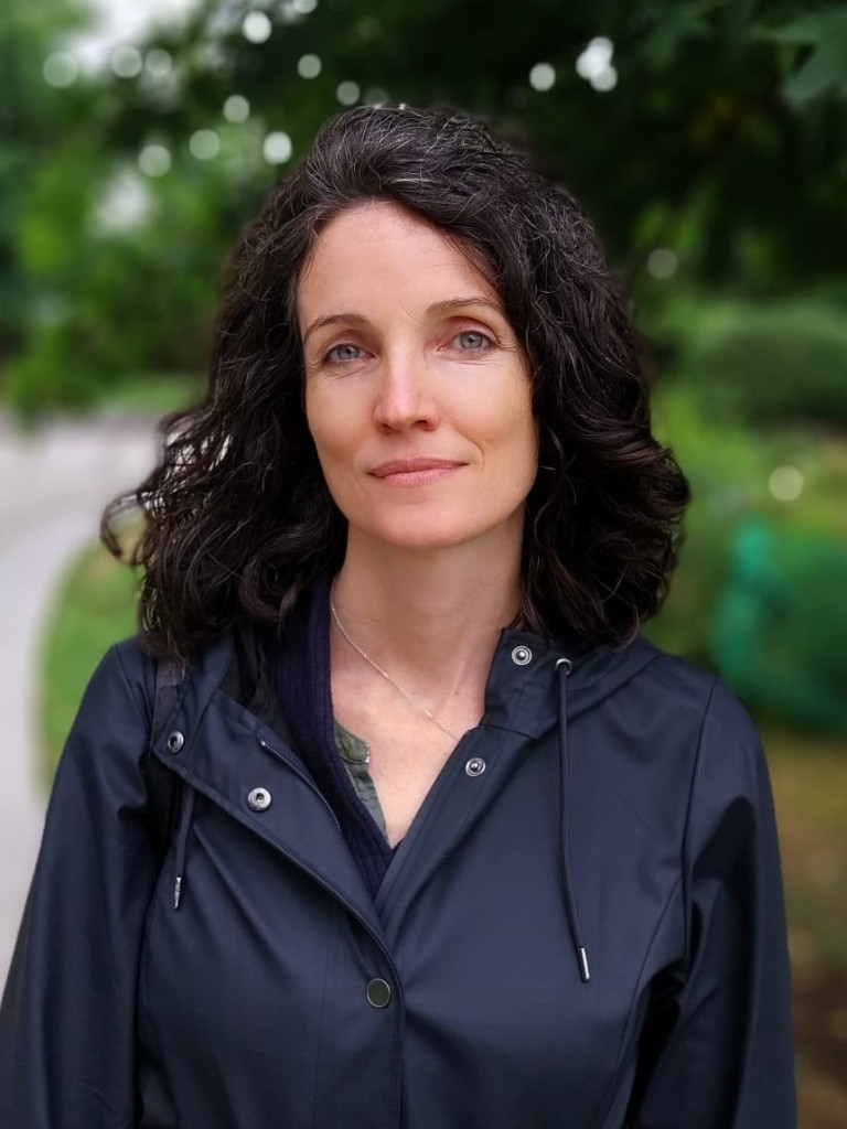 Picture of a 41 year-old white woman with dark hair and green eyes