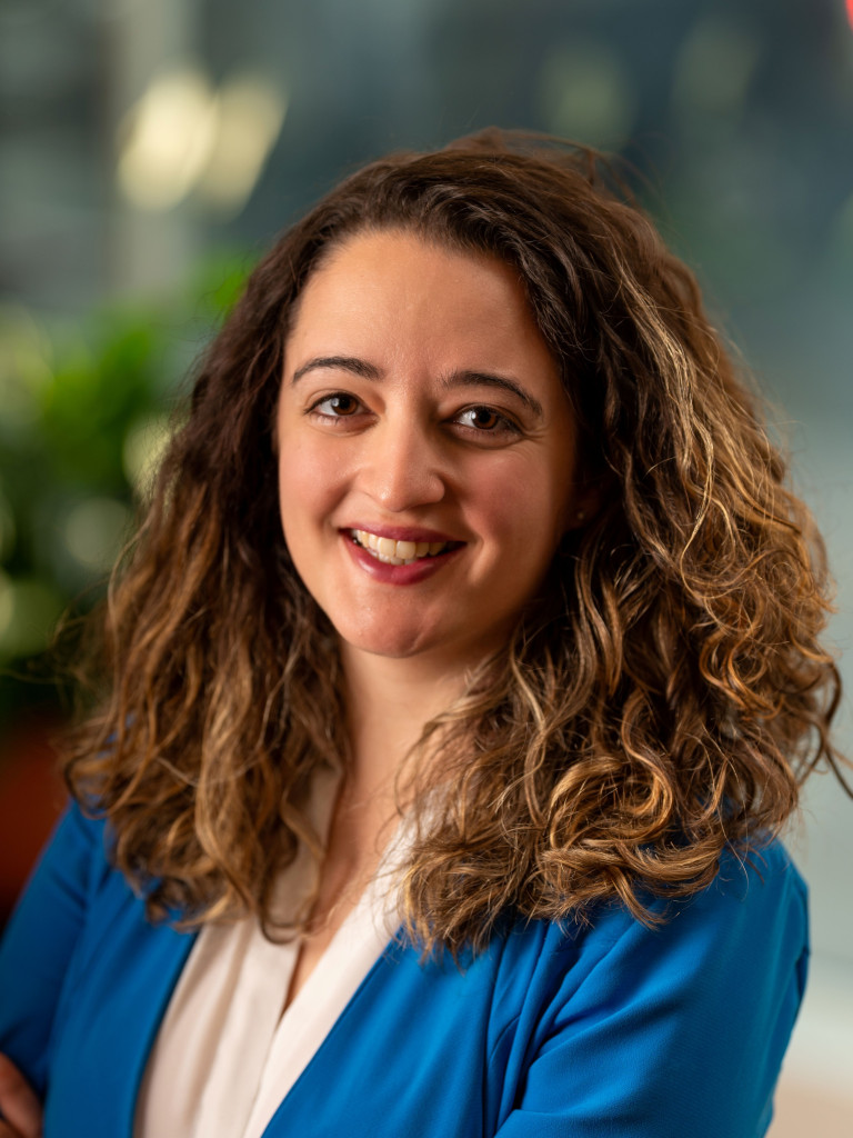 Hillary Briffa, a woman with brown hair smiling. 