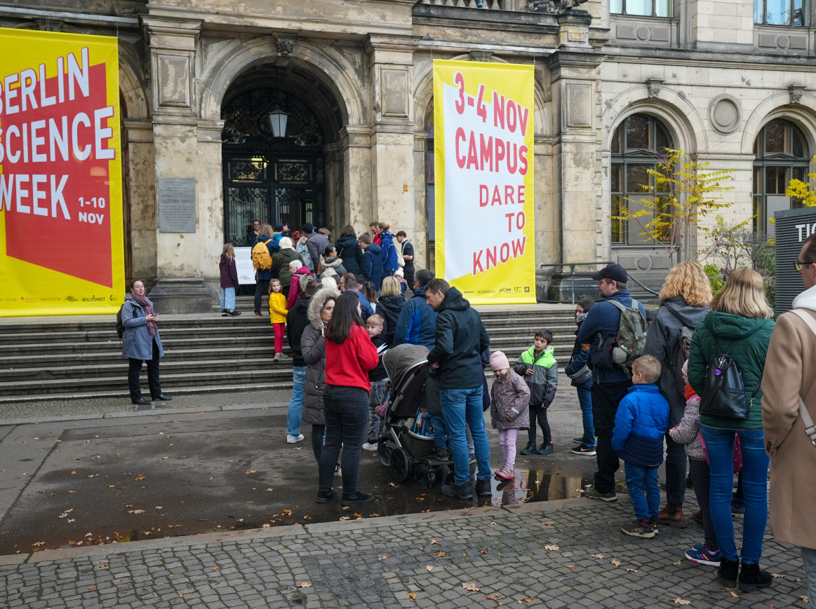 The entra to a museum, with yellow banners hanging on the front