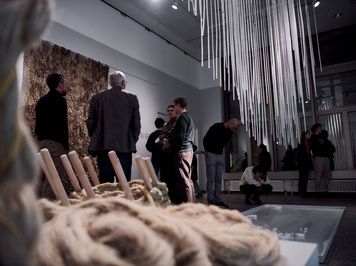 A shot of an exhibition, with ropes in the foreground