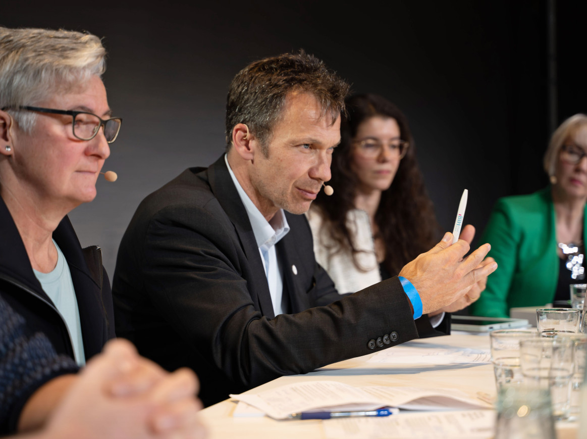 four speaker at a panel discussion in the New Normal Hall of the Berlin Science Week CAMPUS