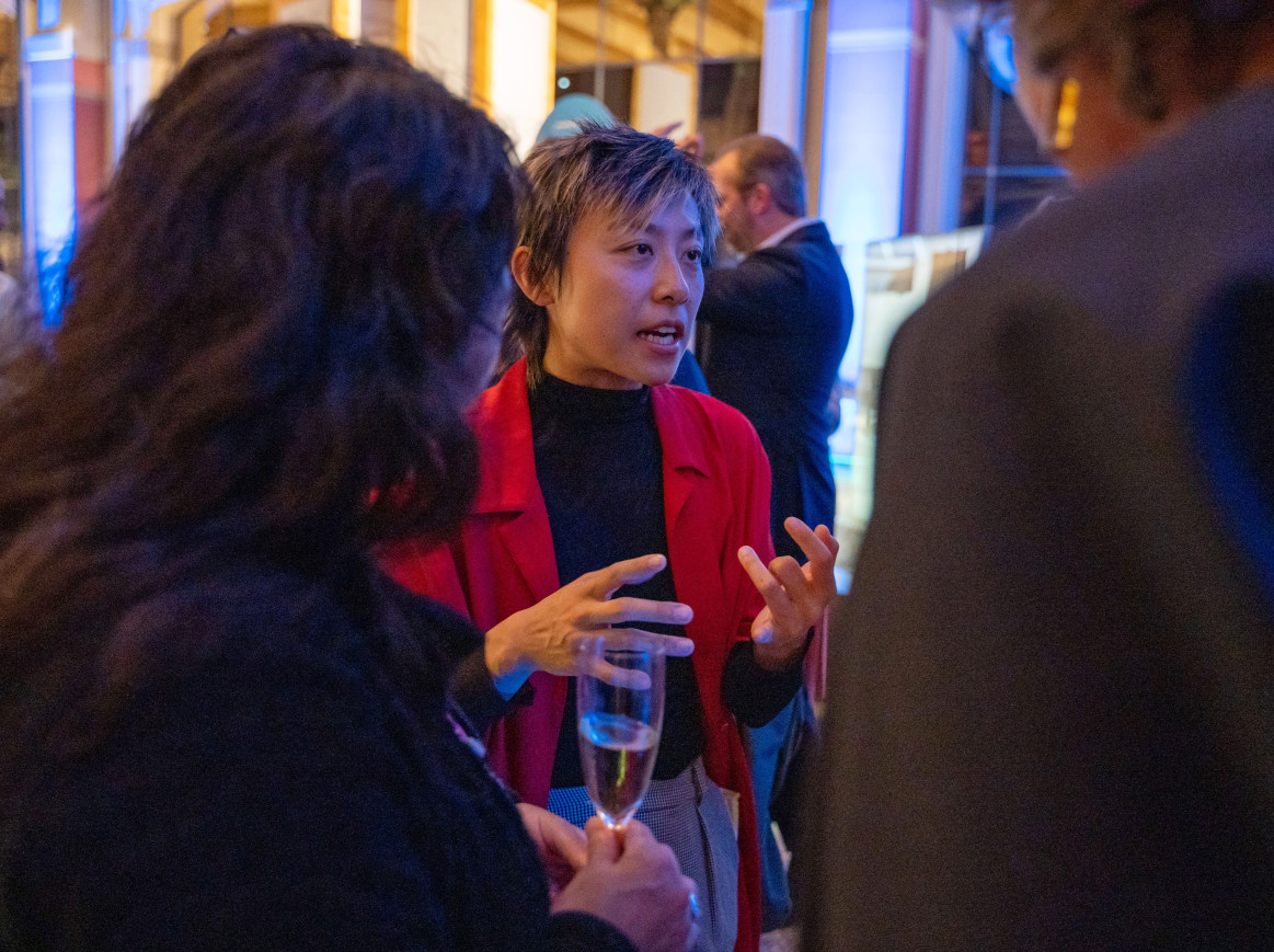woman talking to a small group of people at the Opening of the Berlin Science Week