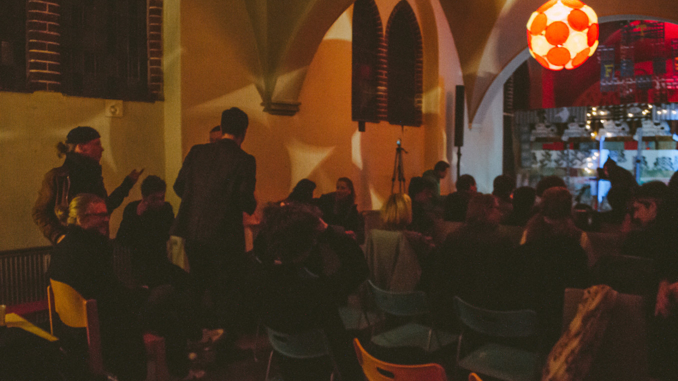 An audience getting ready for a concert.