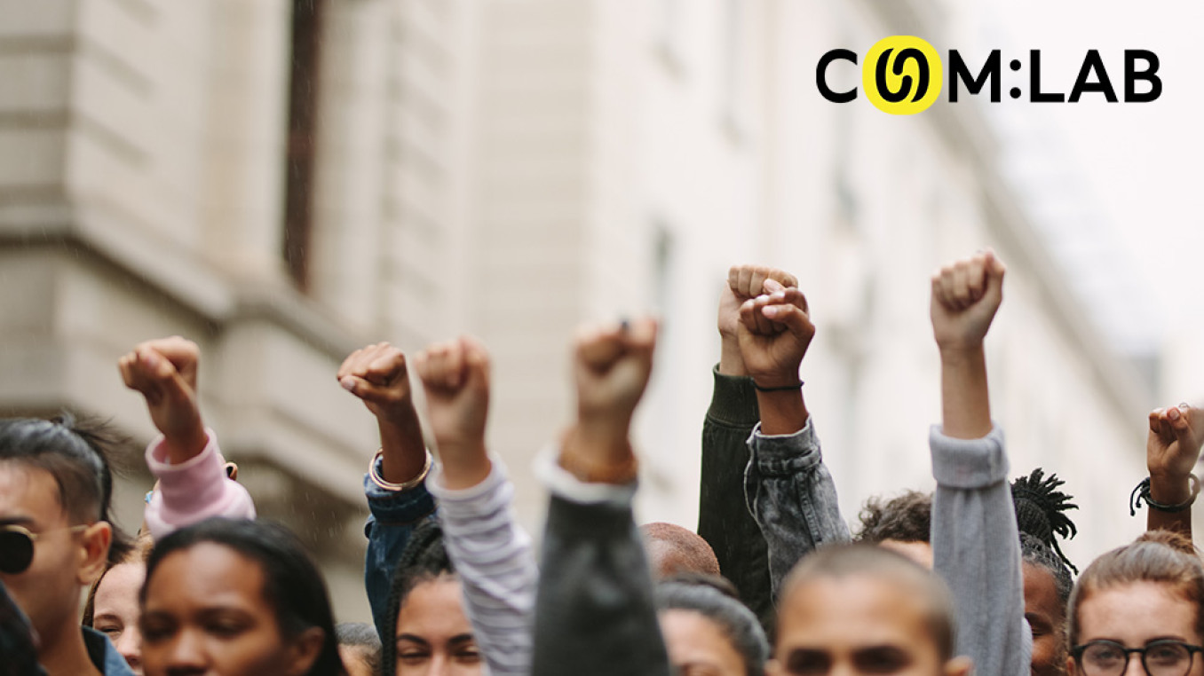 people raising their hands in protest